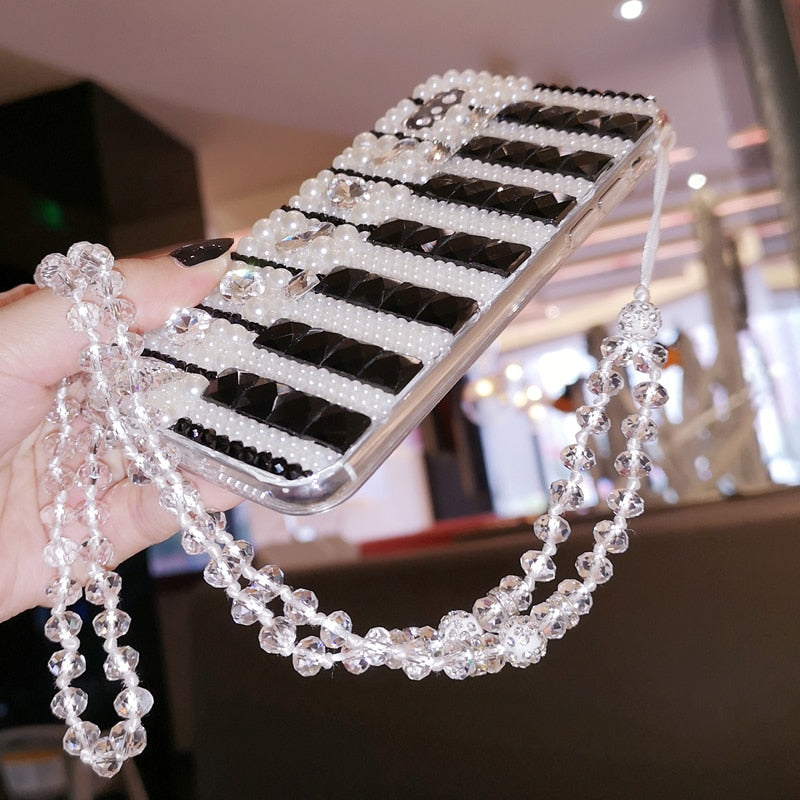 Embellished Piano Keys Phone Case  https://mbell-ish.com/products/embellished-piano-key-phone-case  A stunning phone case and music lover is sure to adore! Compatible Brand: SamsungFeatures: Pearl, Diamond, Black & White Piano Keys, Crystal ChainDesign: Jewelled